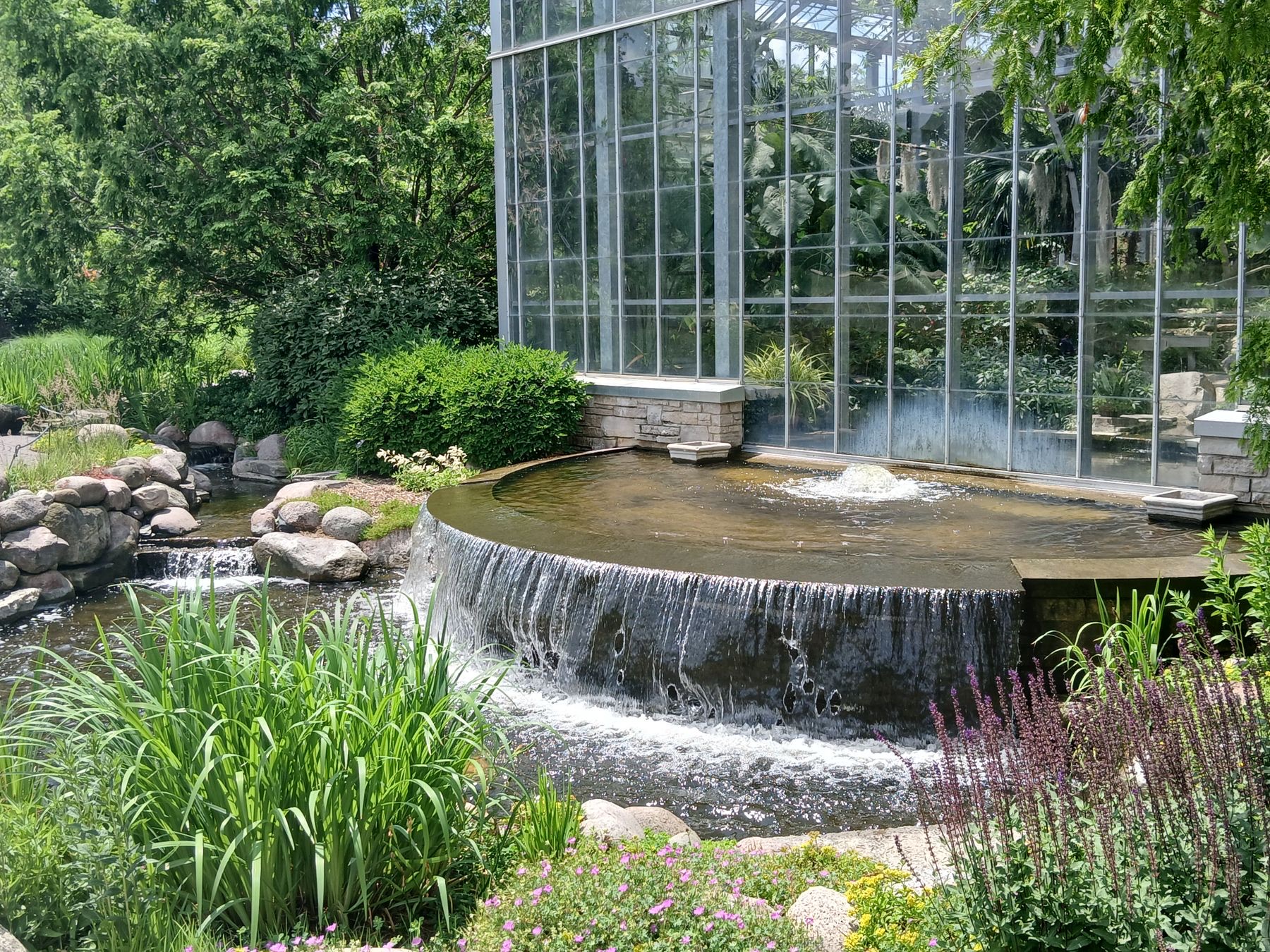 Waterfall beside a glass conservatory in Rockford, Illinois